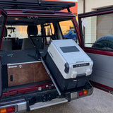 Tilted fridge slider with gas struts
